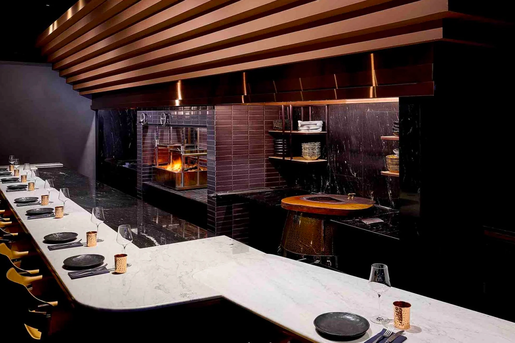 Revolver's open-kitchen is decorated handsomely with a mix of marble tones and copper accents (Image: Revolver)