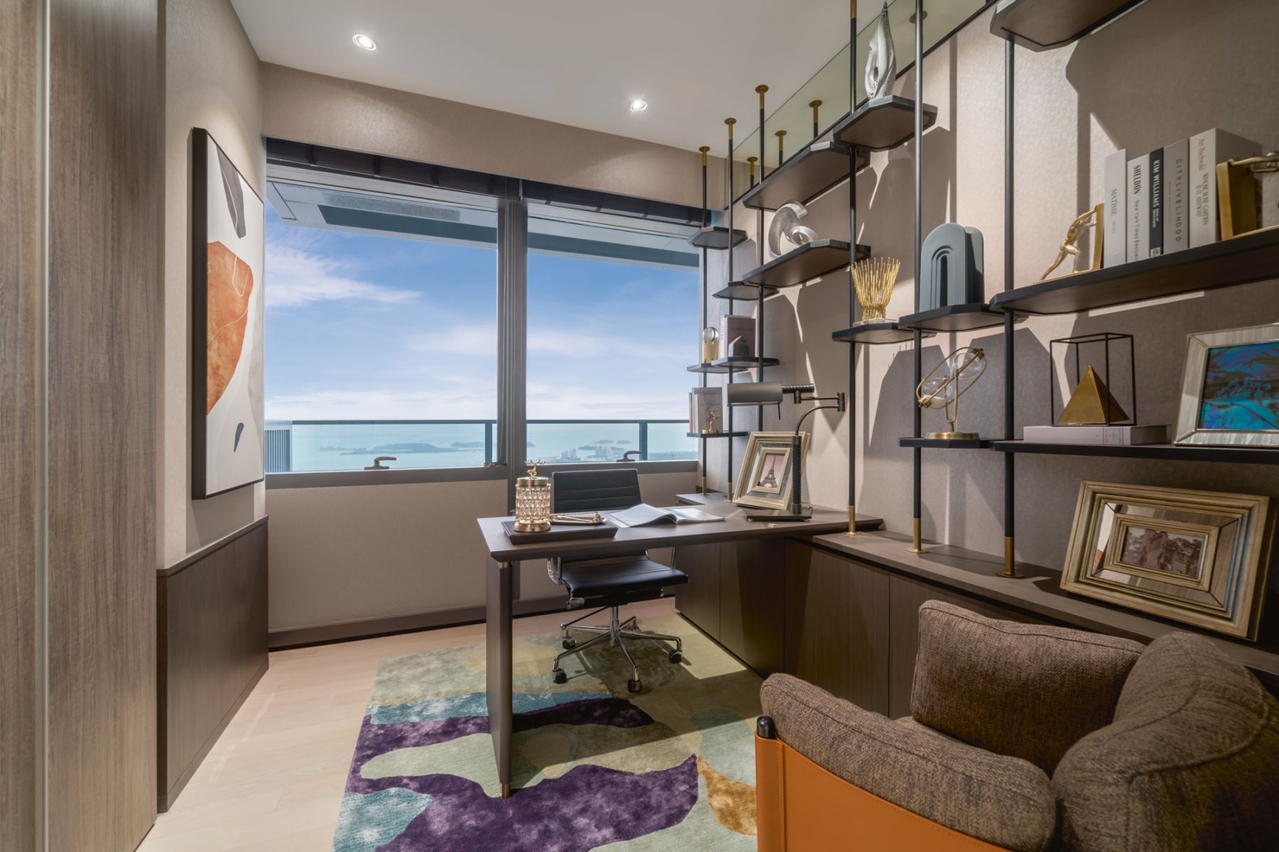 Vibrant jewel tones on a rug and other decorative pieces enliven the home office