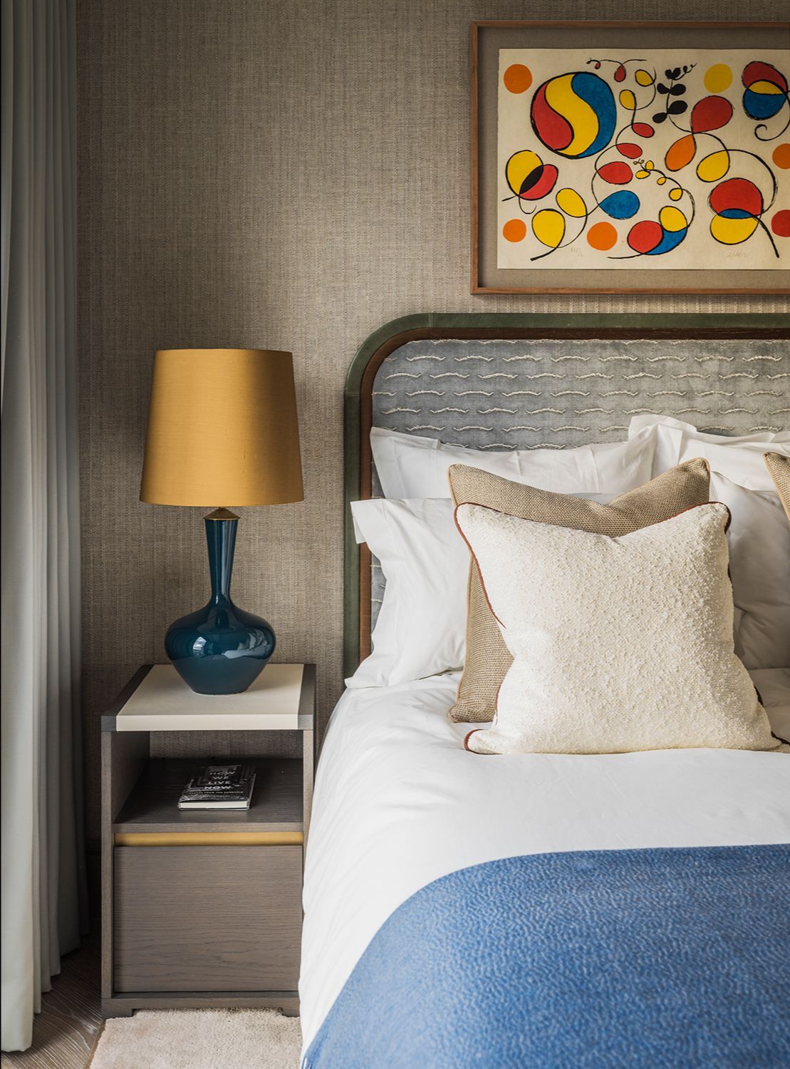 One of the two guest bathrooms in the home, which feature elegant wool fabrics and woven wall coverings