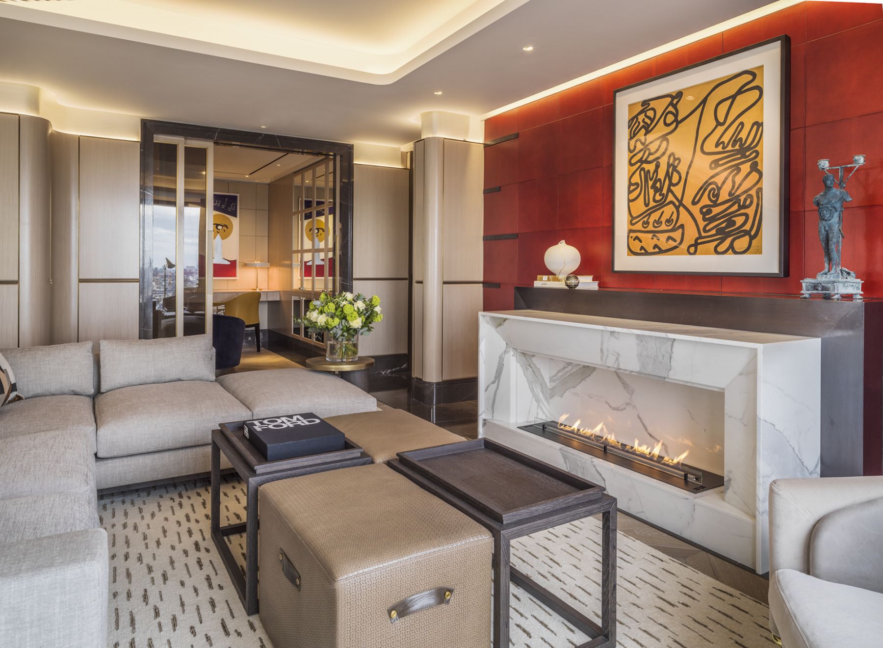 The bold and vibrant feature wall is complemented with Italian furniture from Minotti, as well as artworks from the homeowner's personal collection