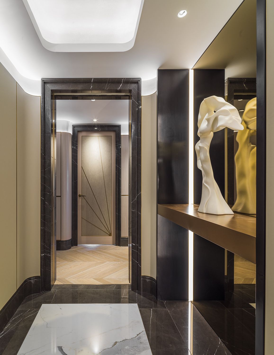 Sculptures and artworks from the homeowner's prized collection can be found in the hallways