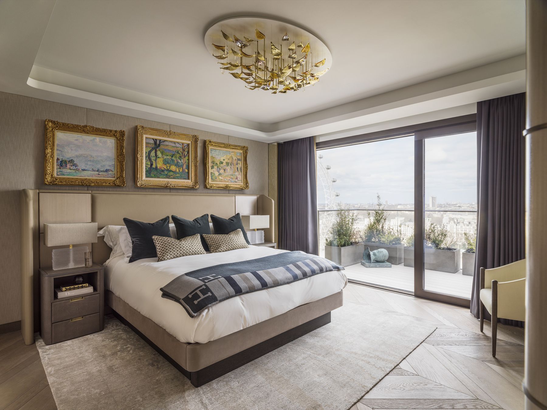 The master bedroom exudes a cosy and inviting ambience with bespoke upholstered textured linen wall panels