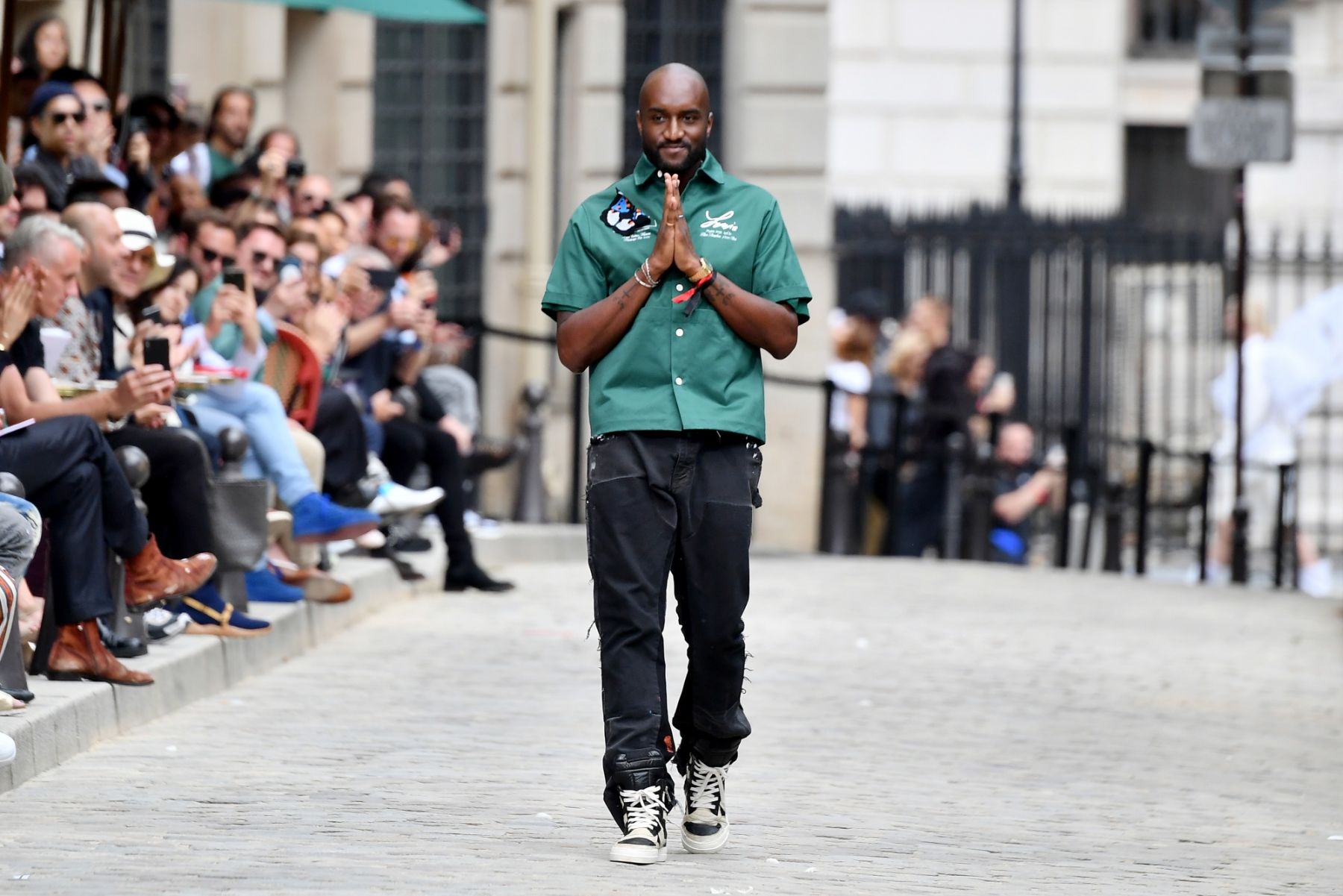 PARIS, FRANCE - JUNE 20: Virgil Abloh greets the crowd during the Louis Vuitton Menswear Spring Summer 2020 show as part of Paris Fashion Week on June 20, 2019 in Paris, France. (Photo by Dominique Charriau/WireImage)