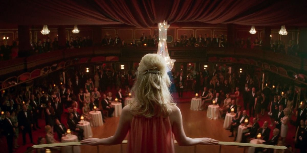 The glamour of the exclusive nightclub is emphasised with rich red tones and glittering chandeliers (Image: Focus Features)