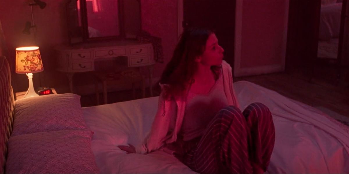 Eloise's bedroom is bathed in neon light every night (Image: Focus Features)