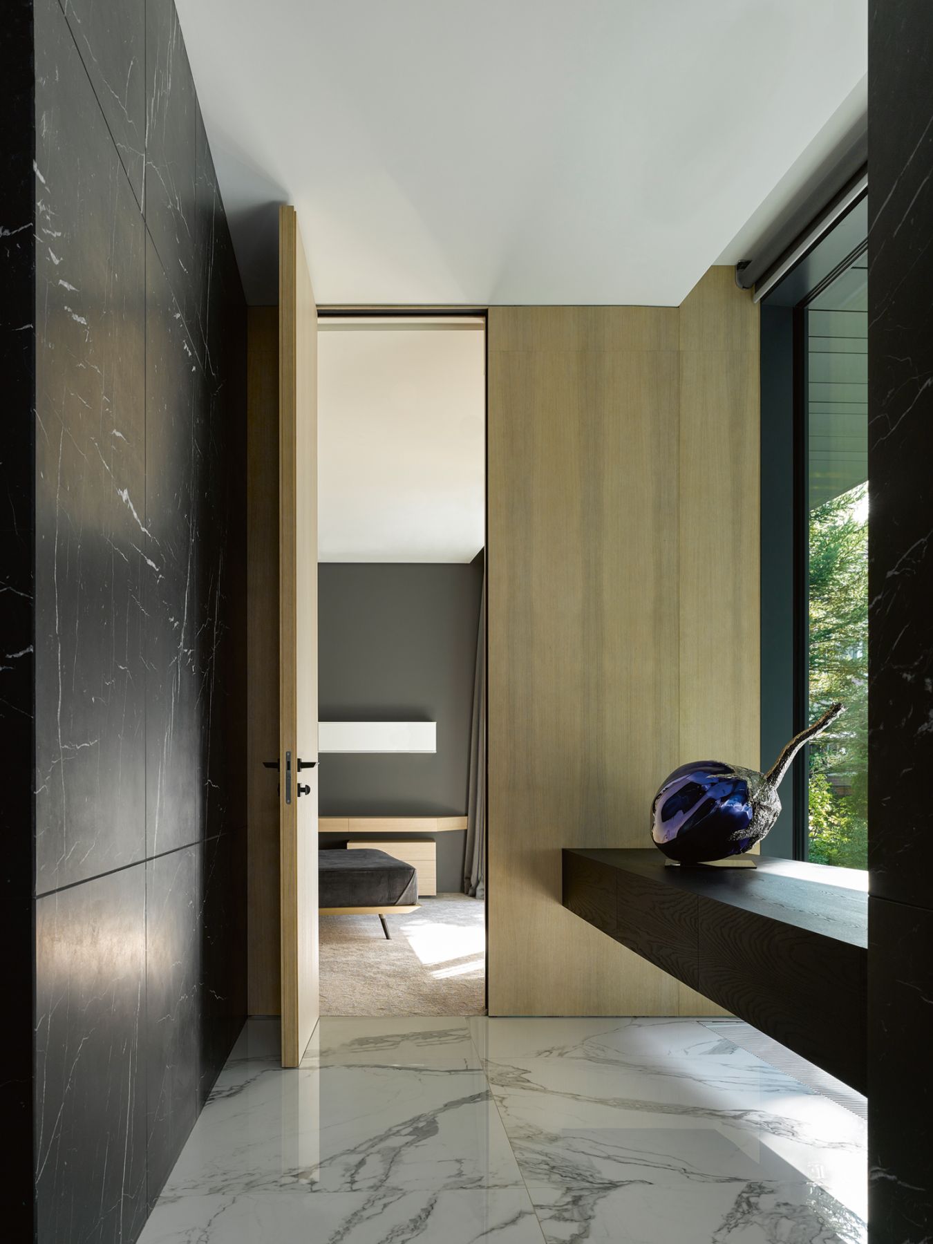 The use of natural materials such as marble, timber and metal provides warmth to the interior