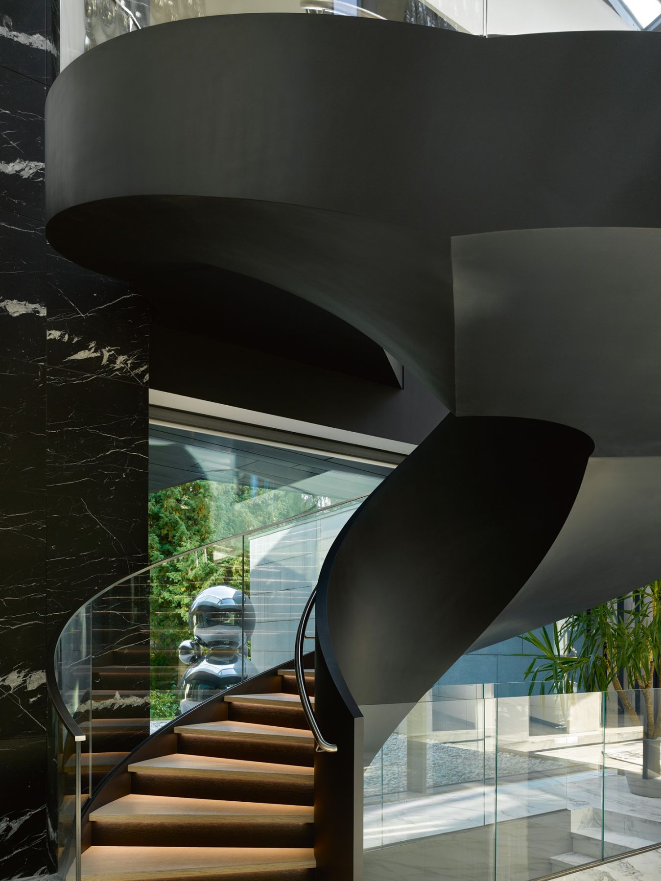 This sculptural staircase is among the architectural flourishes in the home