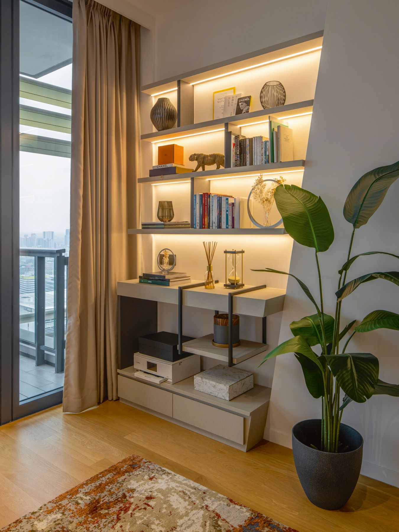 Various decorative objects and books populate this cosy nook