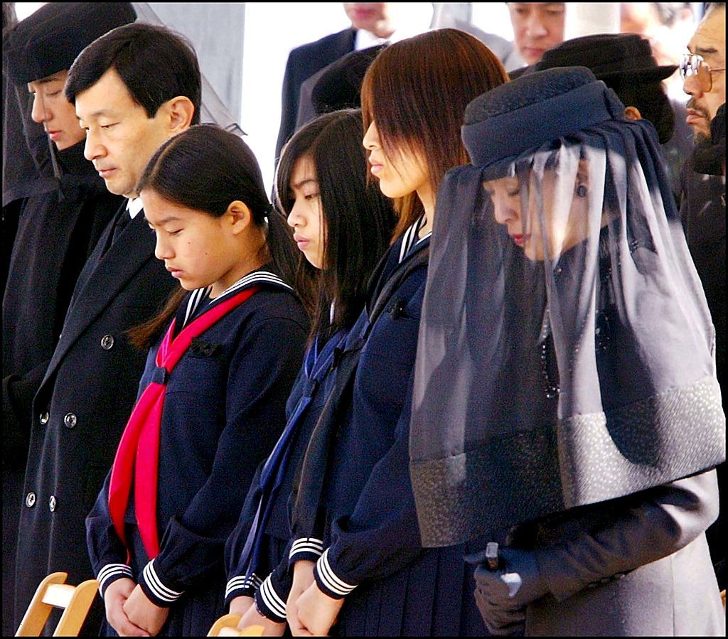 JAPAN - NOVEMBER 29: Funeral ceremony for Prince Takamado In Tokyo, Japan On November 29, 2002 -(Right to left) Princess Hisako, widow of late Prince Takamado, her daughters Tsuguko, Noriko, Ayako, Crown Prince Naruhito and Crown Princess Masako attend the funeral ceremony for Prince Takamado at the Toshimagaoka cemetery. Prince Takamado, 47, died o (Photo by Pool Interagences/Gamma-Rapho via Getty Images)