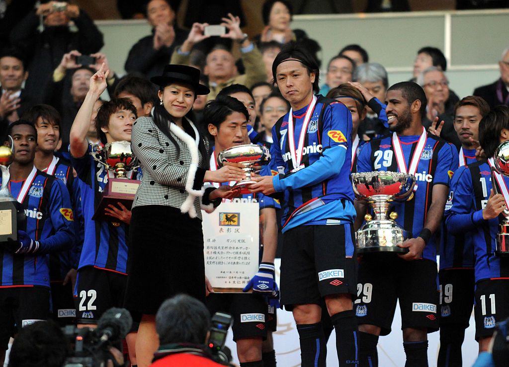 YOKOHAMA, JAPAN - DECEMBER 13: (EDITORIAL USE ONLY) Yasuhito Endo of Gamaba Osaka receives the Emperor's Cup from Pricess Tsuguko of Takamado during the award ceremony after the Emperor's Cup final match between Gamba Osaka and Montedio Yamagata at Nissan Stadium on December 13, 2014 in Yokohama, Kanagawa, Japan. (Photo by Hiroki Watanabe/Getty Images)