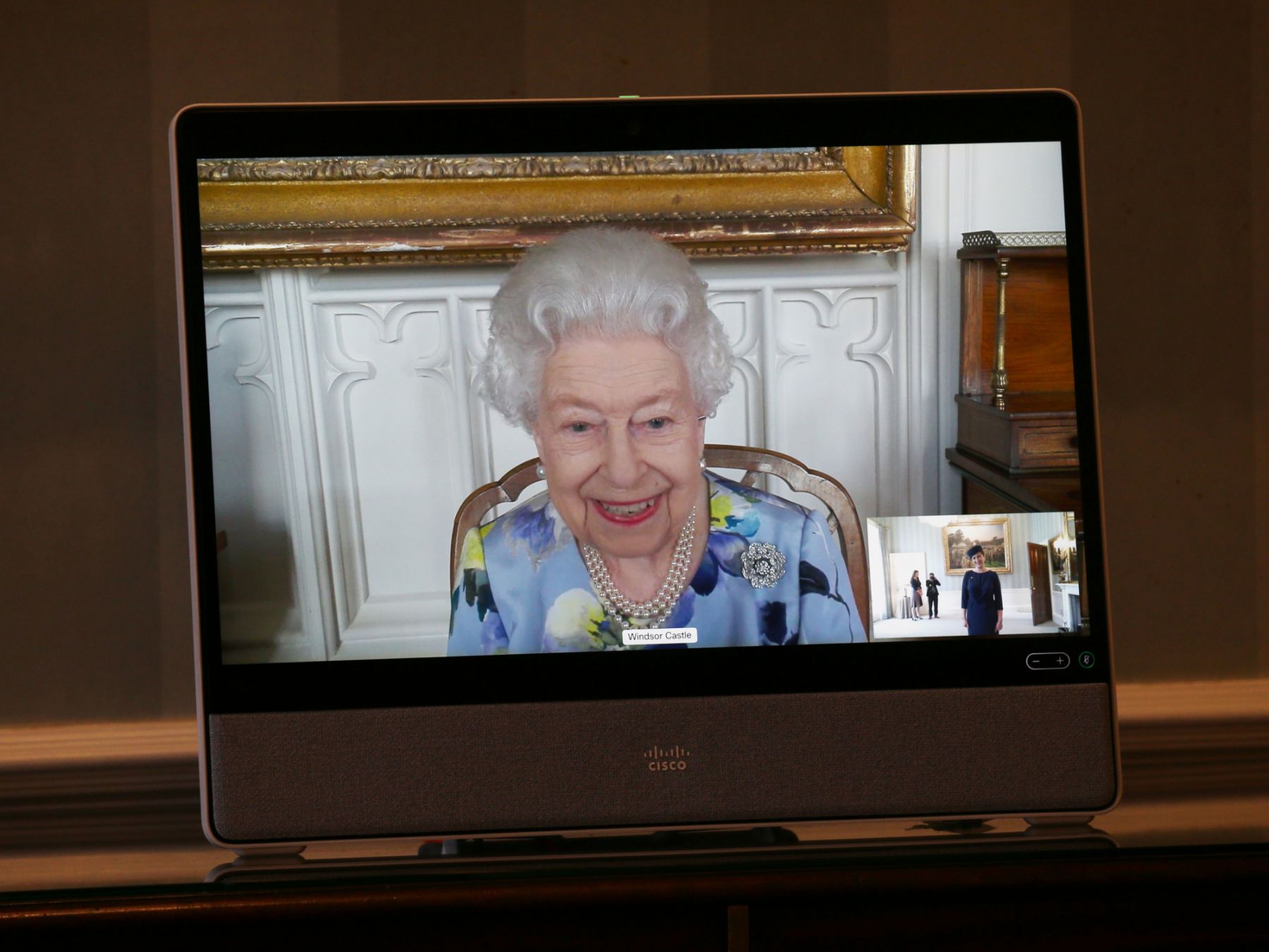 LONDON, ENGLAND - APRIL 27: Queen Elizabeth II appears on a screen by videolink from Windsor Castle, where she is in residence, during a virtual audience to receive Her Excellency Ivita Burmistre, the Ambassador of Latvia at Buckingham Palace on April 27, 2021 in London, England. (Photo by Yui Mok - Pool/Getty Images)