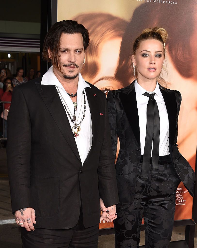 WESTWOOD, CA - NOVEMBER 21: Johnny Depp and Amber Heard attend the premiere of Focus Features' 'The Danish Girl' at Westwood Village Theatre on November 21, 2015 in Westwood, California. (Photo by Jason Merritt/Getty Images)