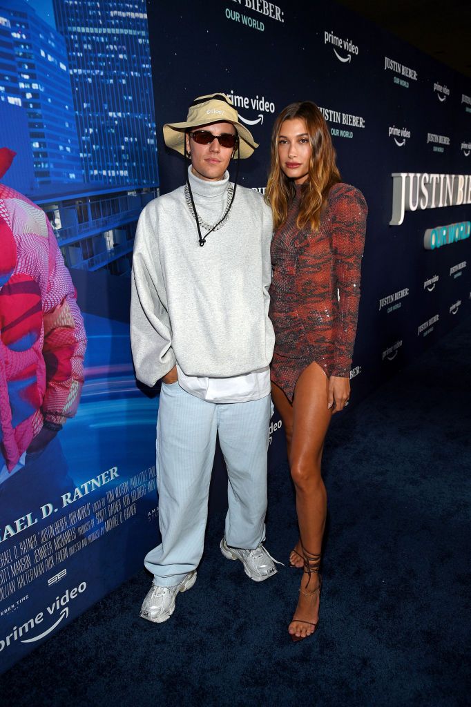 NEW YORK, NEW YORK - SEPTEMBER 14: Justin Bieber (L) and Hailey Bieber attend the Justin Bieber: Our World event at The Edge at Hudson Yards on September 14, 2021 in New York City. (Photo by Kevin Mazur/Getty Images for Amazon Studios)