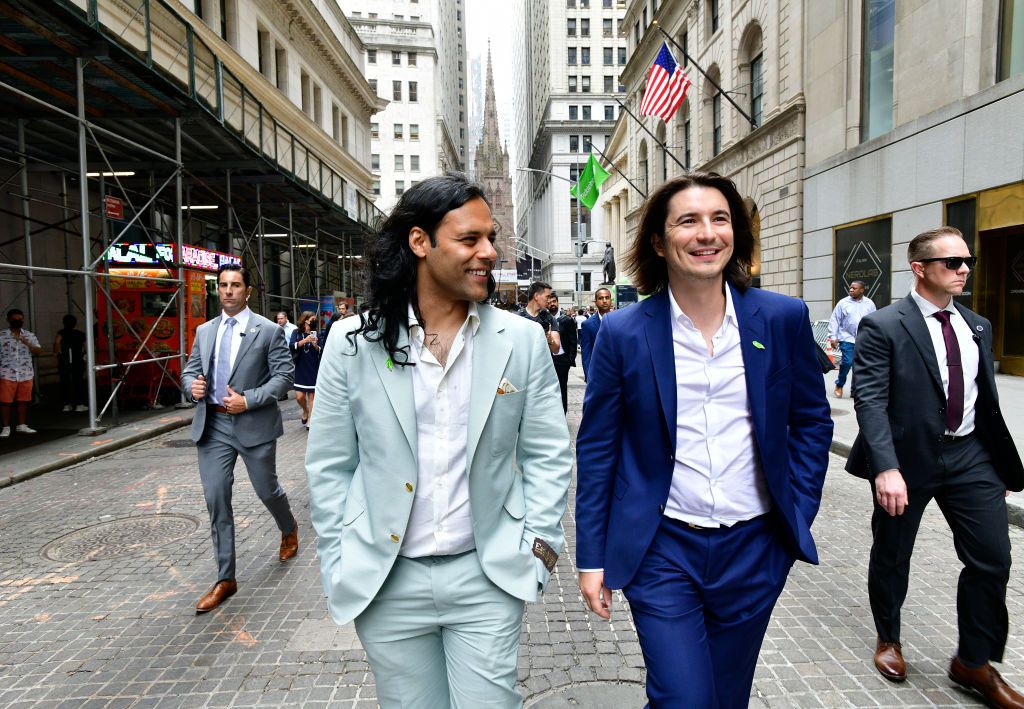 NEW YORK, NEW YORK - JULY 29: : Baiju Bhatt and Vlad Tenev walk on Wall Street during Robinhood Markets IPO Listing Day on July 29, 2021 in New York City. (Photo by Eugene Gologursky/Getty Images for Robinhood)