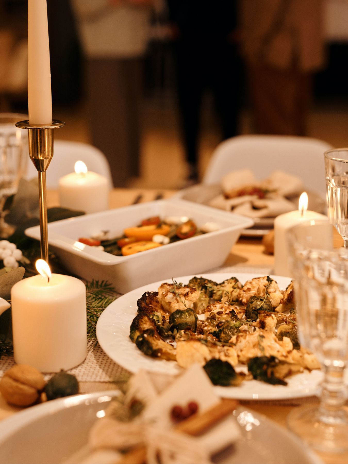 Use a mixture of candles and candlesticks for a warm glow (Image: Nicole Michalou/Pexels)