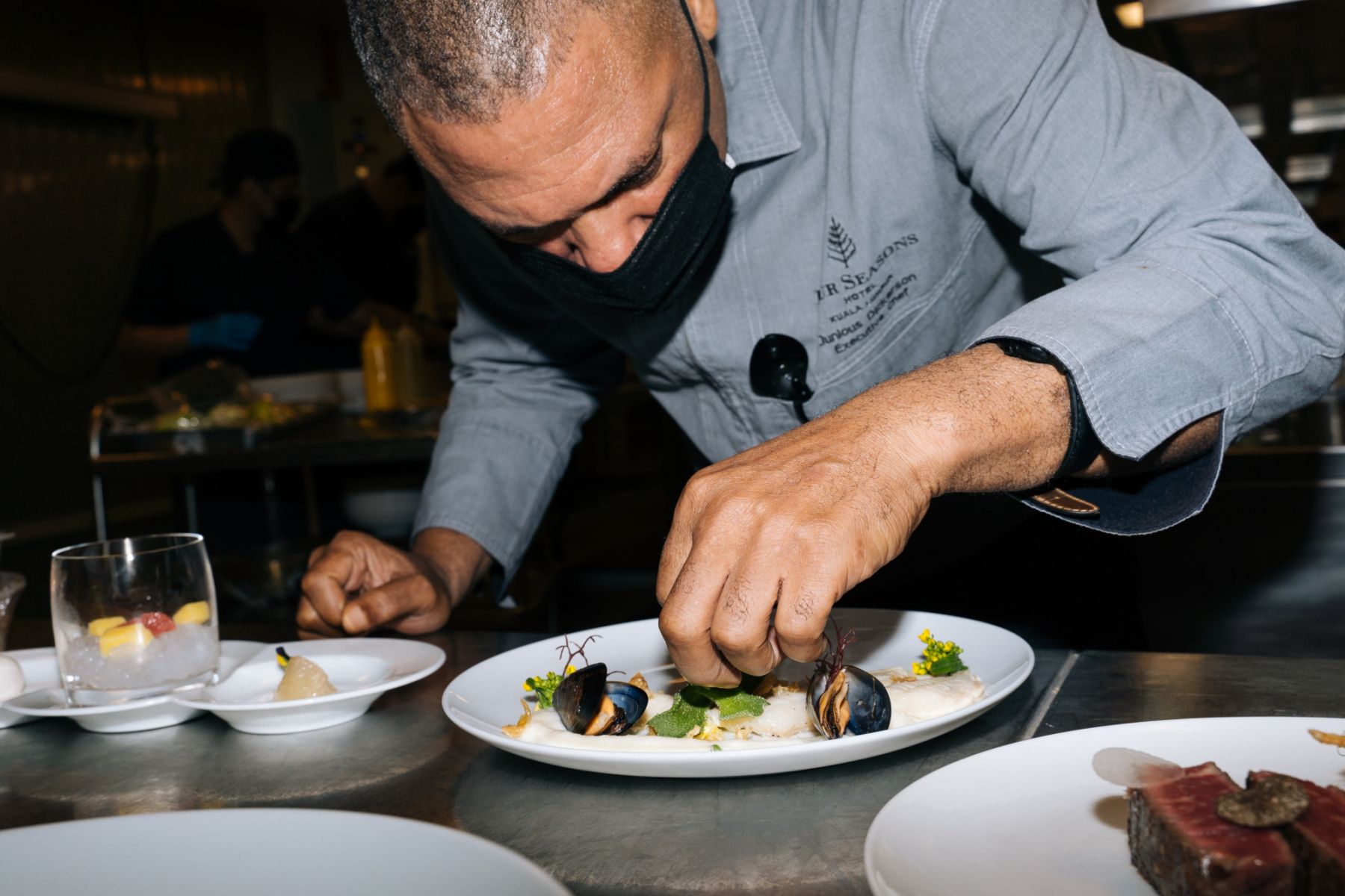Chef Junious Dickerson plating a meal