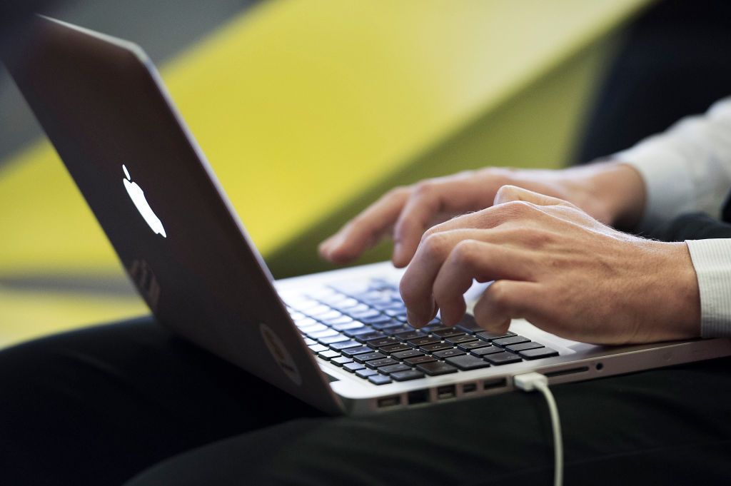 Note-taking on a computer during a business meeting: someoneÃs hands typing on a keyboard (Photo by: Andia/Universal Images Group via Getty Images)