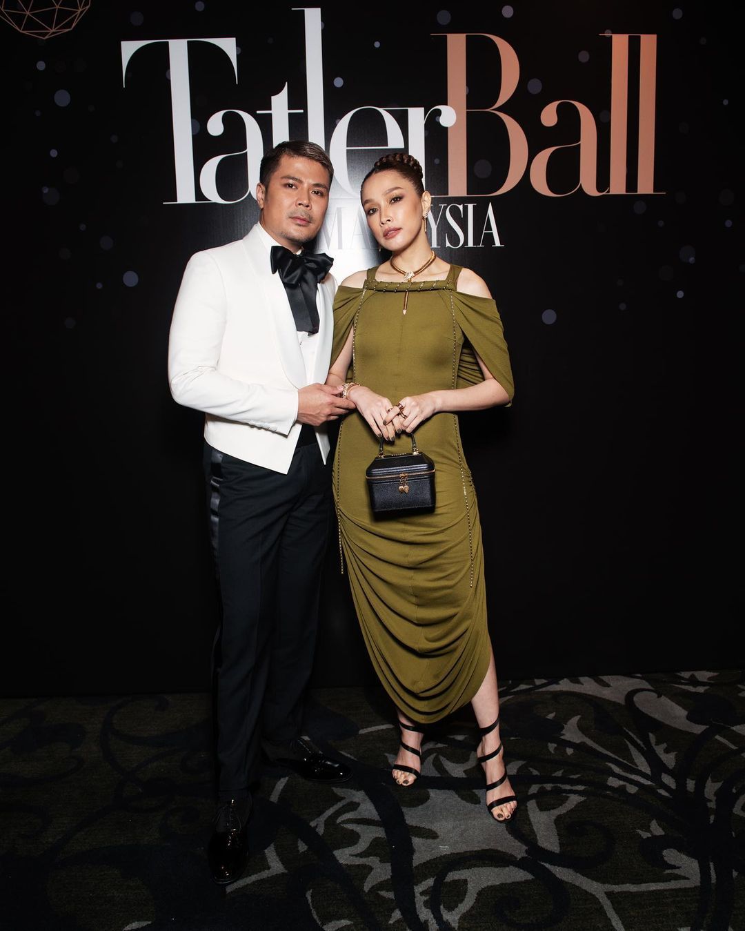 Scha Alyahya in Loewe dress and Bulgari jewellery and accessories, and Awal Ashaari in Bernard Chandran