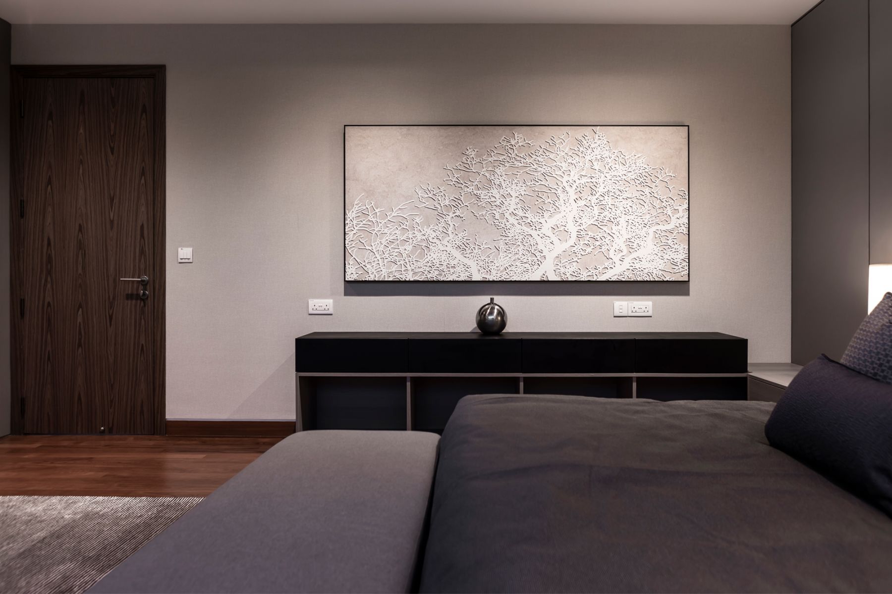 A intricate painting adds visual interest to a blank wall