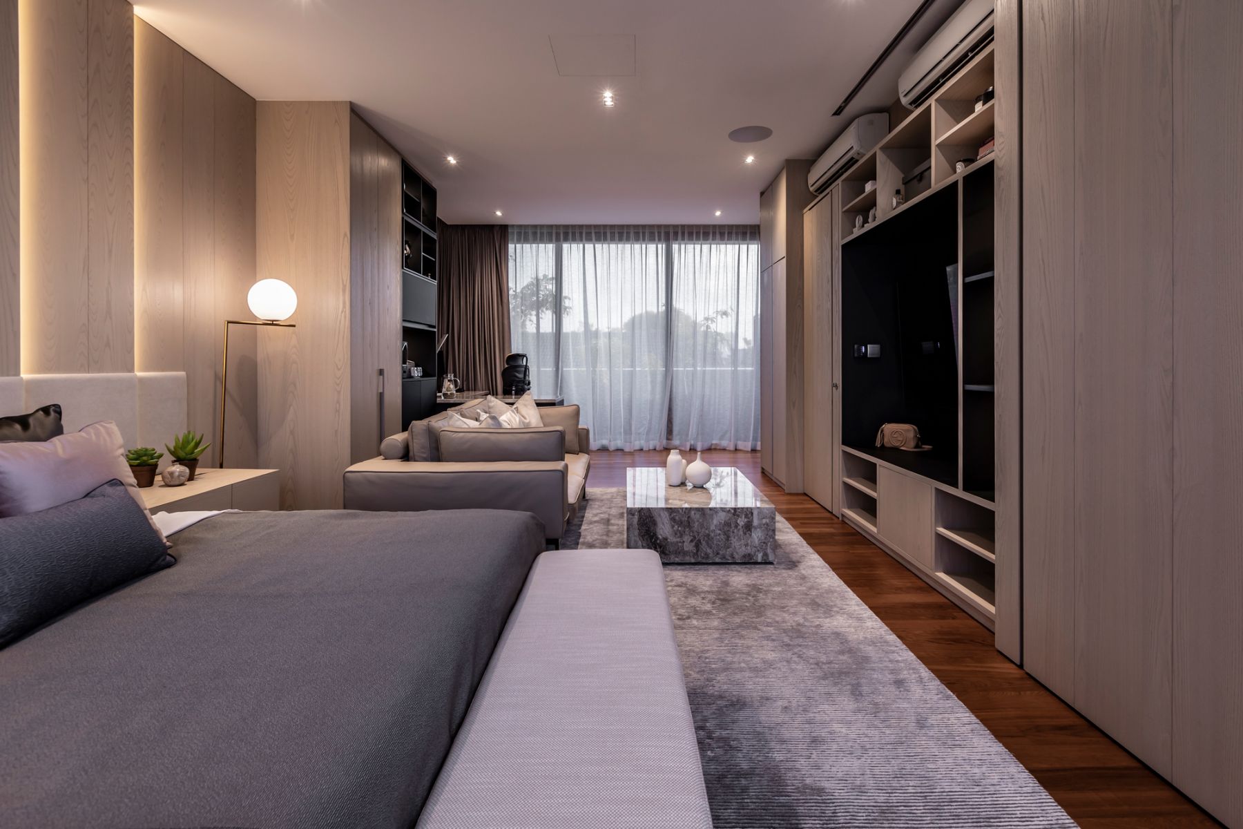 This stunning room is a warm and inviting space clad in light wood