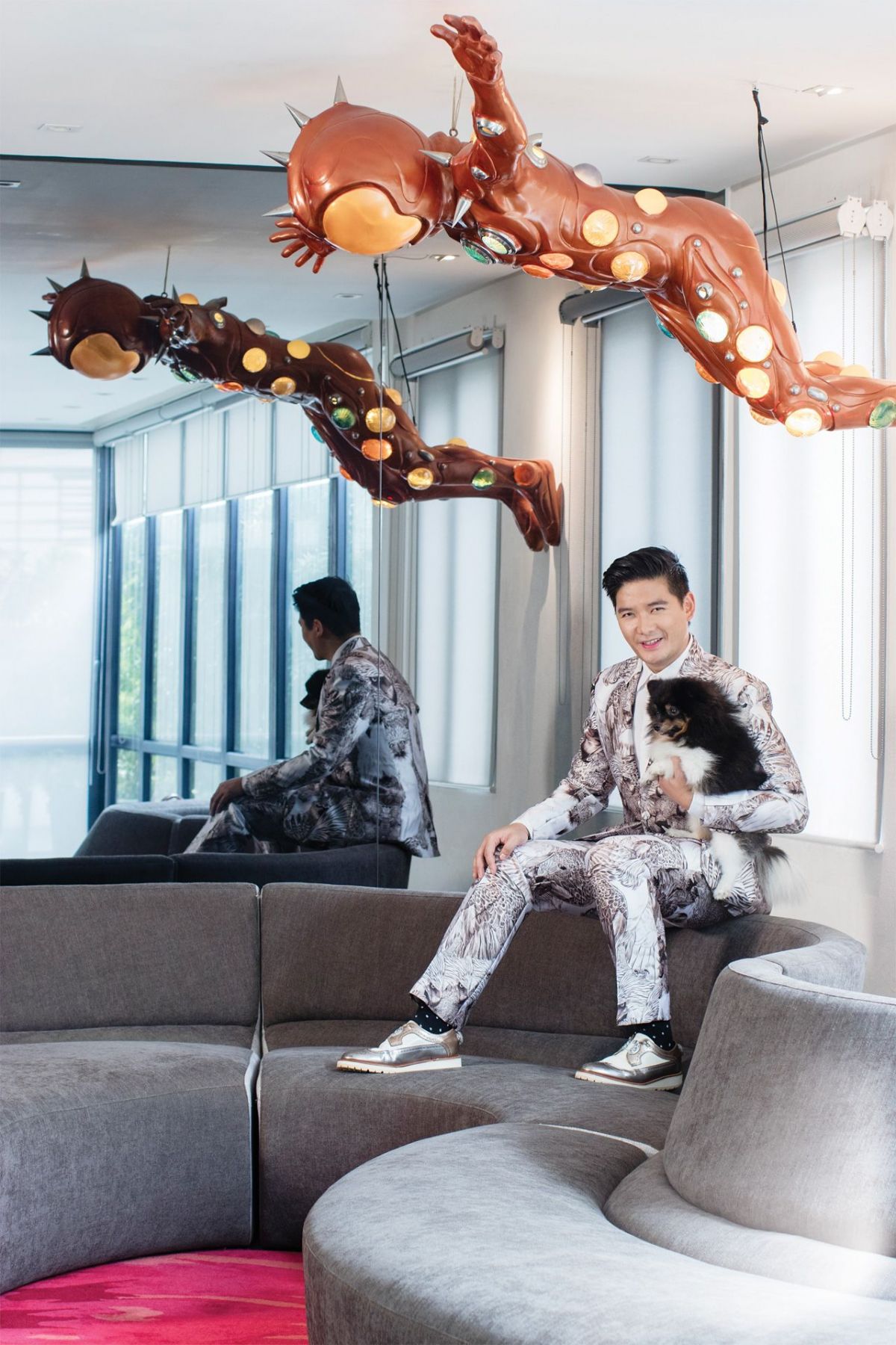 Tim with one of his dogs, Panda, in the second floor living room (Photographed by Aldwin Aspillera)