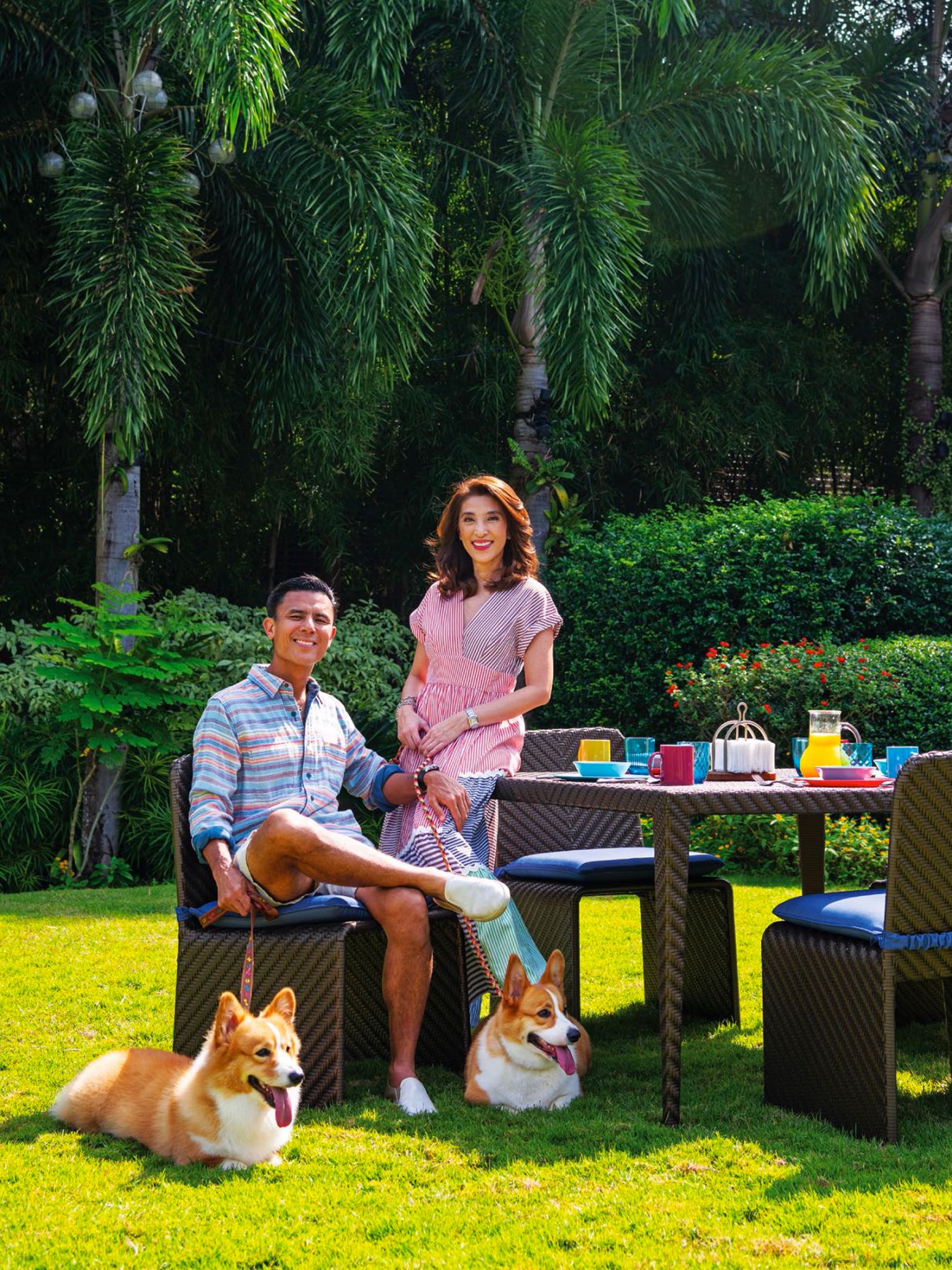 Donnie and Crickette Tantoco in their outdoor garden, together with their corgies (Photographed by Scott A Woodward)