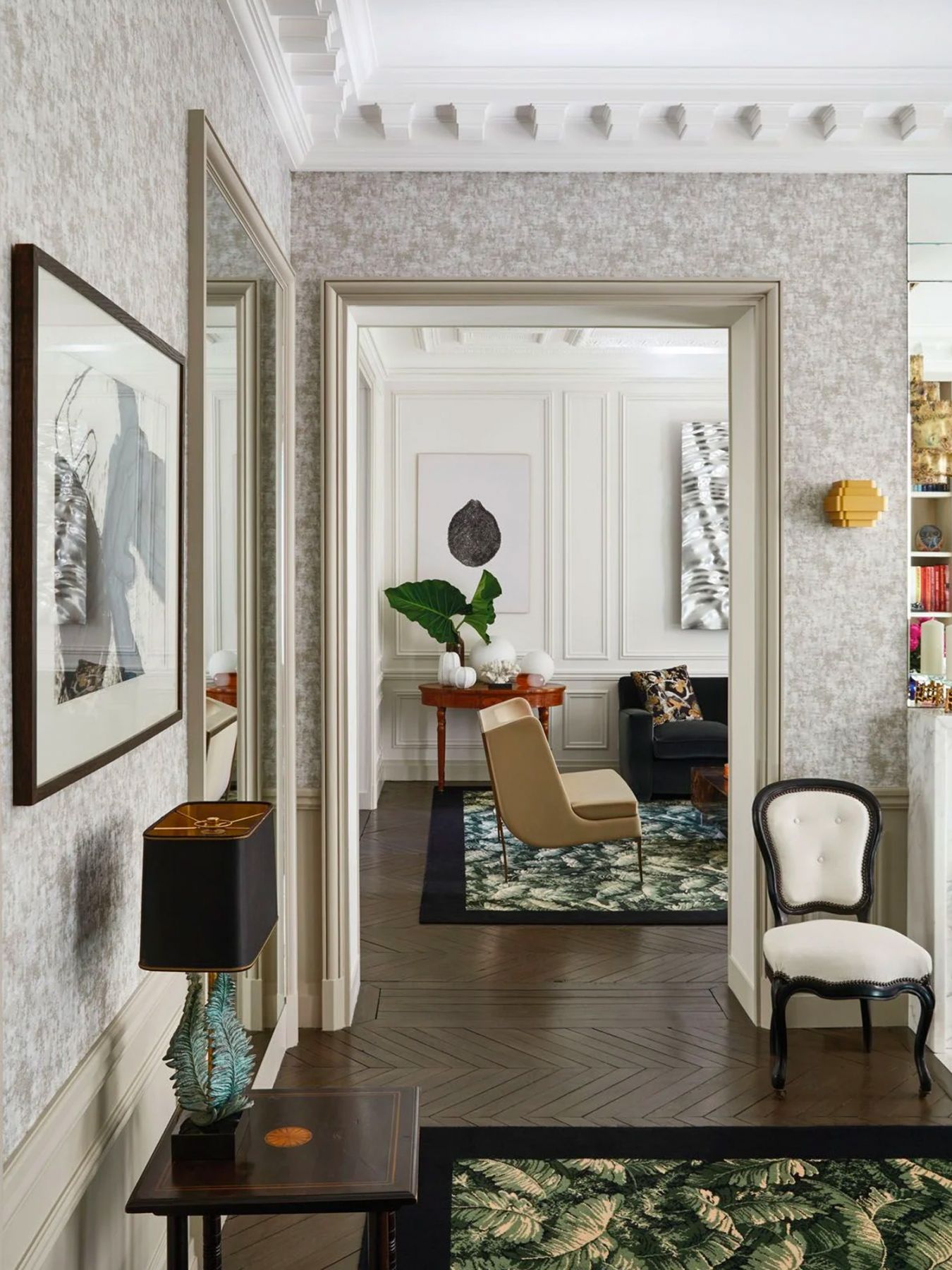 A pair of rugs from Les Manufactures Catry in a banana leaf pattern adds a verdant touch to the home (Photographed by Francis Amiand)