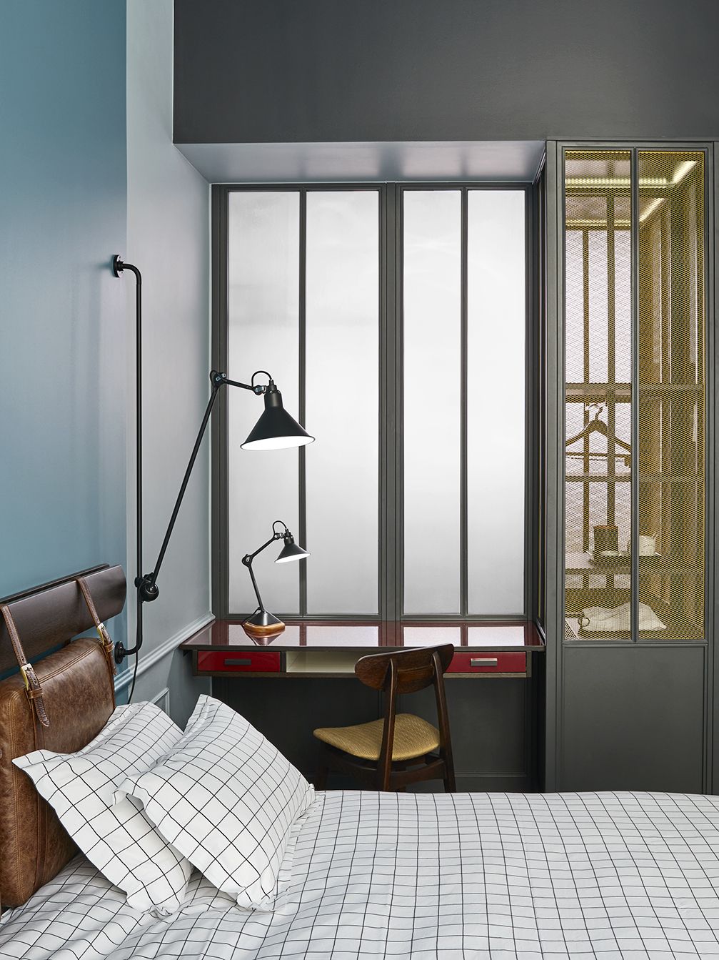 A striking bedroom with stylish accents in The Hoxton Hotel, Paris, designed by Humbert & Poyet
