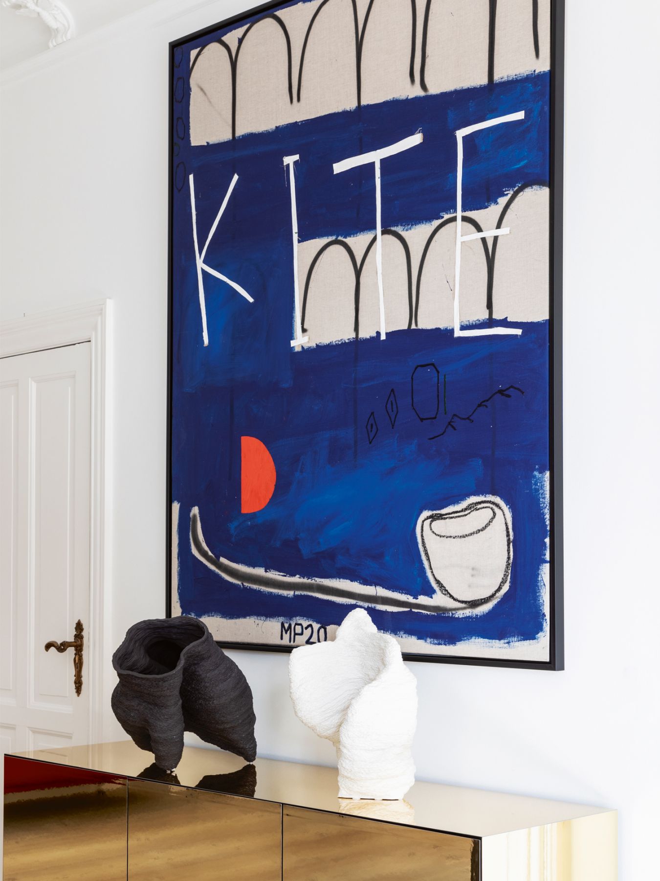 Sculptures by Eyvind Solli Andreassen decorate a Boform console in the dining room
