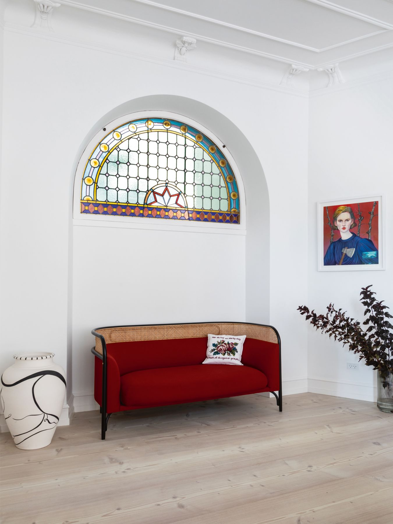 This stained glass window is among the beautiful historical features of the apartment