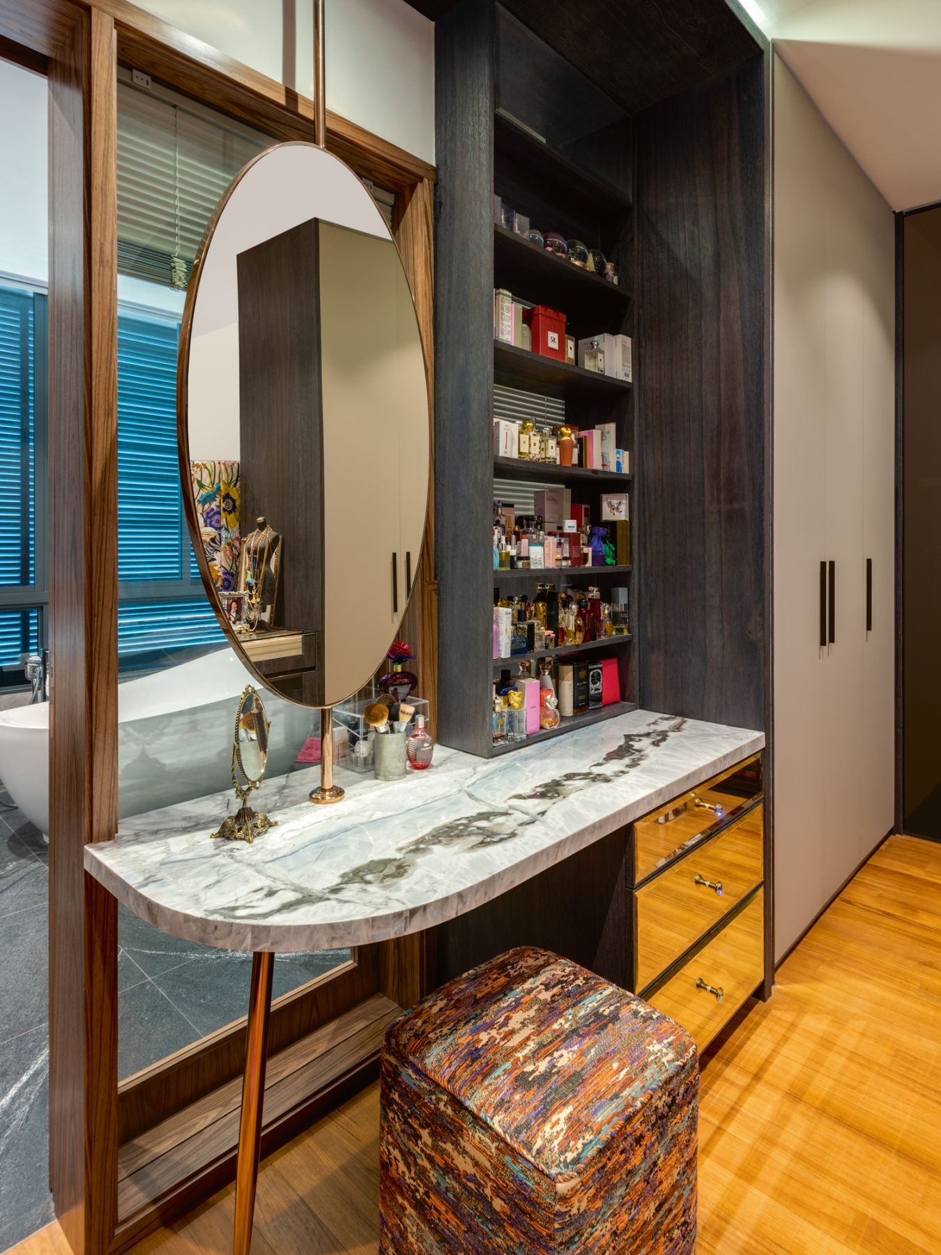 A custom vanity table is among the intriguing details in this room
