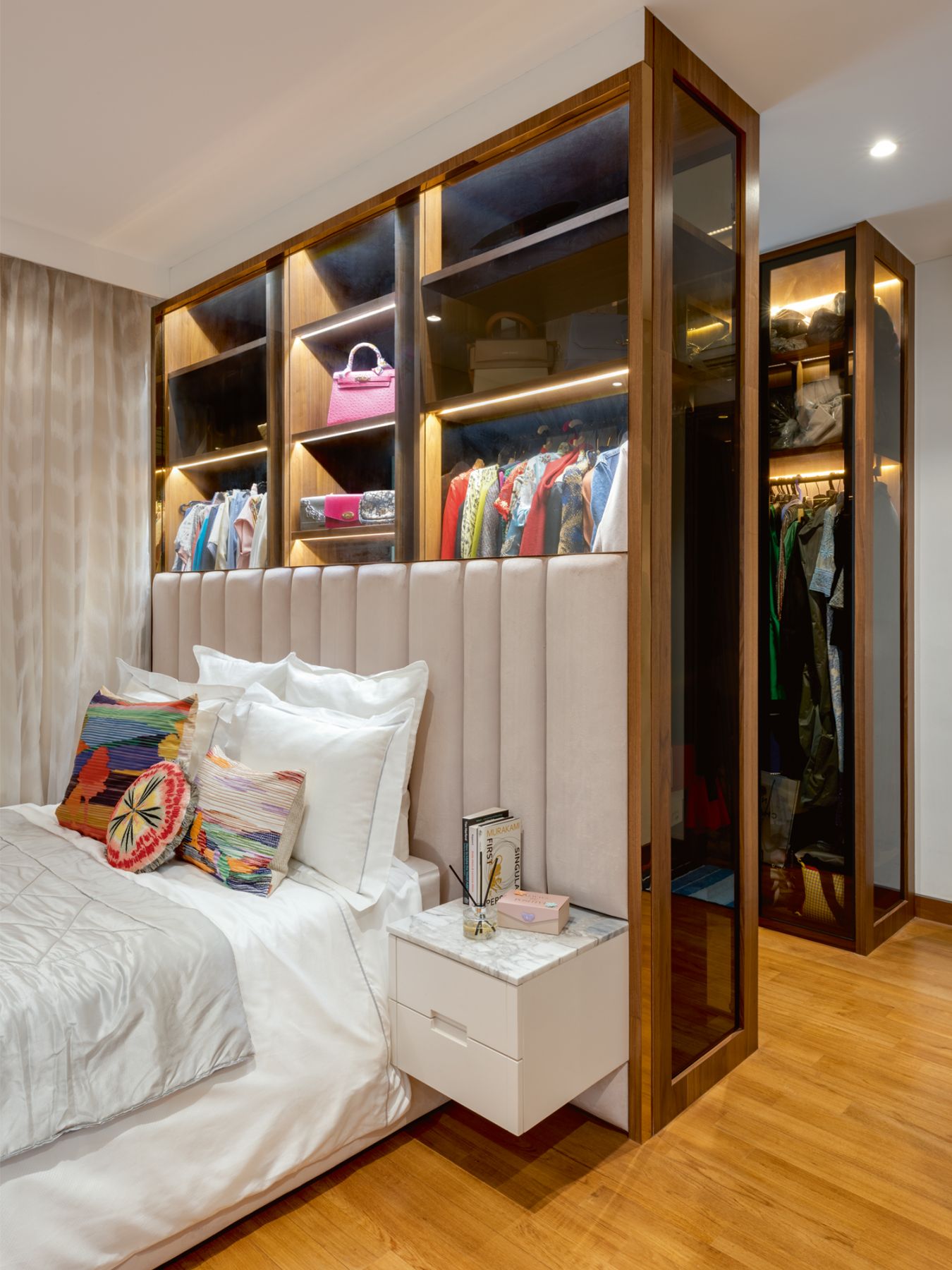 The daughter’s room features full-height custom cabinetry for her clothes and bags