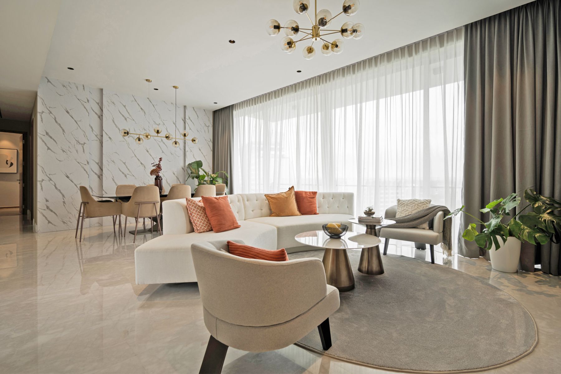 Cushions in bright orange and yellow tones bring a lively touch to the room