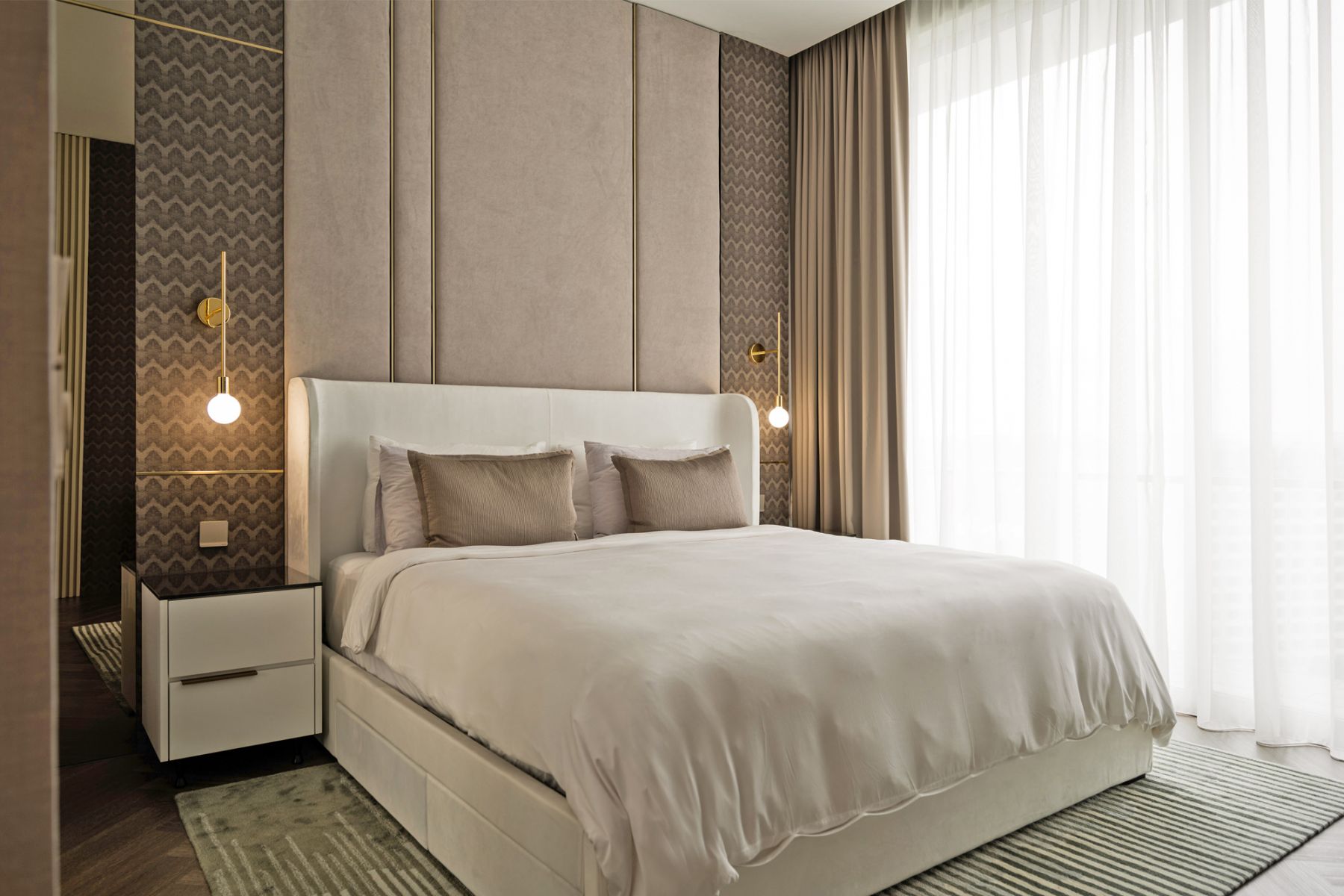 The master bedroom is a calming sanctuary with dark colours