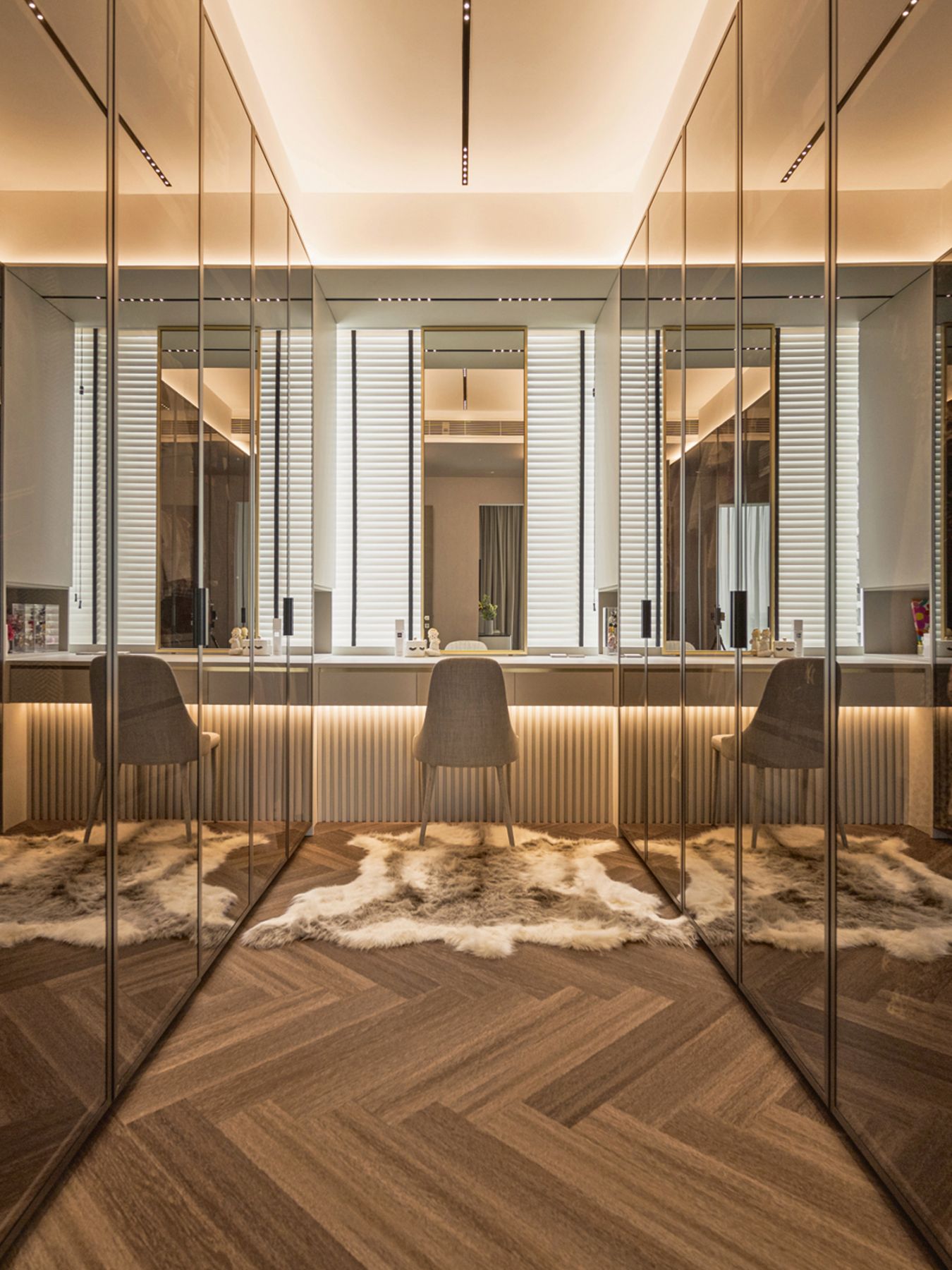 The walk-in wardrobe features a dusky scheme