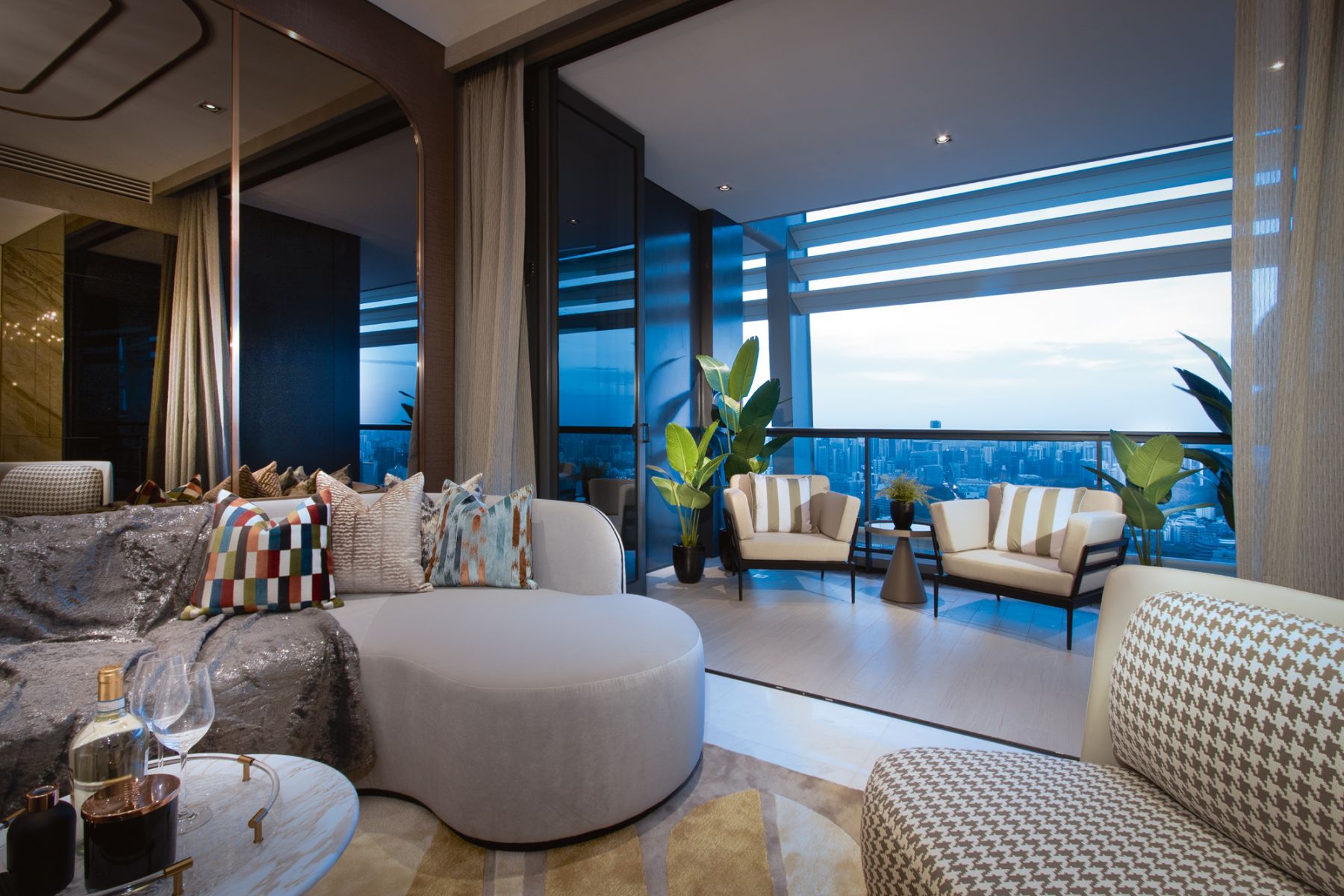 Playful patterns on the accent cushions and soft furnishings bring contrast to the living area and balcony
