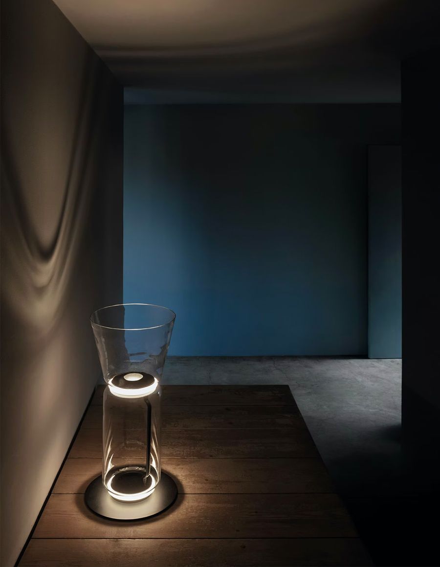 At night, the lamp throws intriguing shadows onto the wall