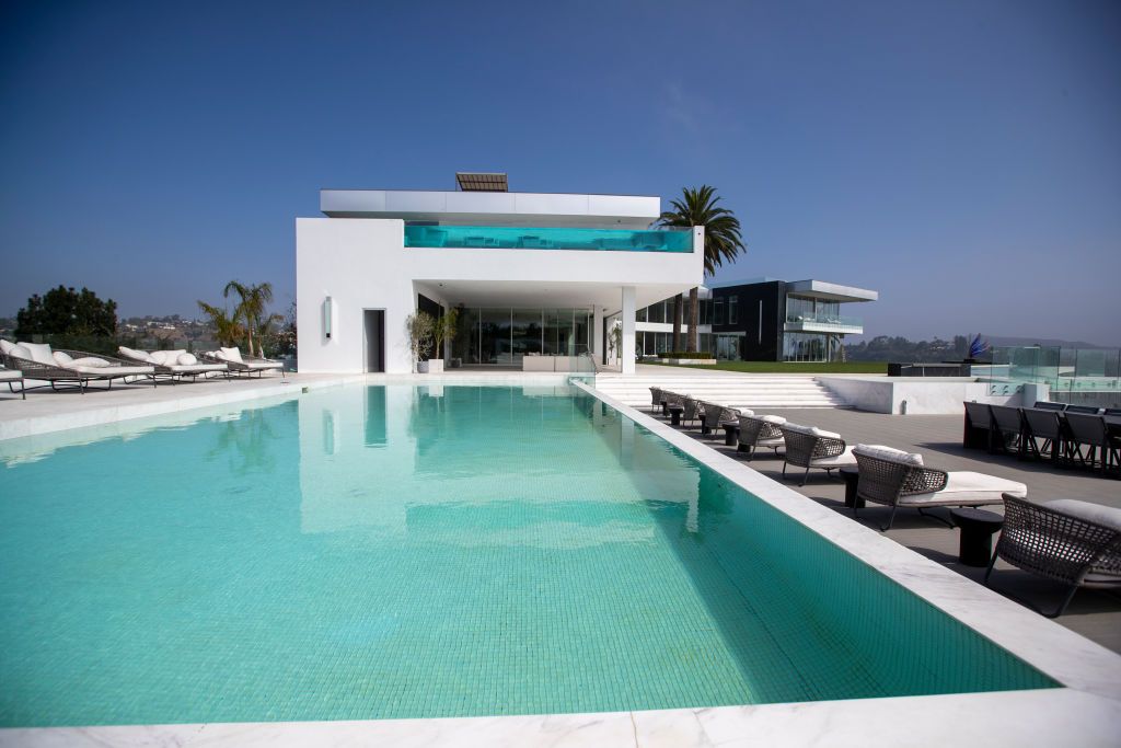 Beverly Hills, CA - September 08: A view of a pool with 4,000-square bedroom above with private pool at the The One Bel Air, a 105,000-square-foot mansion by Nile Niami of Skyline Development and designed by Paul McClean (McClean Design). The One is shown by court-appointed receiver Ted Lanes, who now controls the property and is in charge of finding a buyer and paying off the lenders and other creditors, gives a tour of The One, the 105,000 square foot house on sale in Bel Air. This is apparently the larg