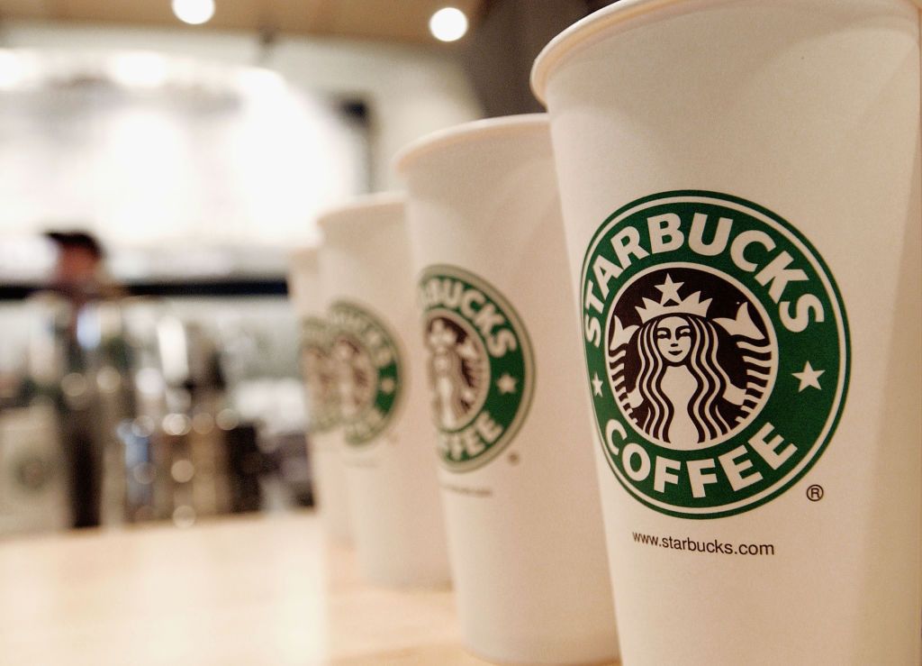 NEW YORK - AUGUST 5: Beverage cups featuring the logo of Starbucks Coffee are seen in the new flagship store on 42nd Street August 5, 2003 in New York City. The Seattle-based coffee company has emerged as the largest food chain in the Manhattan borough of New York with 150 outlets. (Photo by Stephen Chernin/Getty Images)