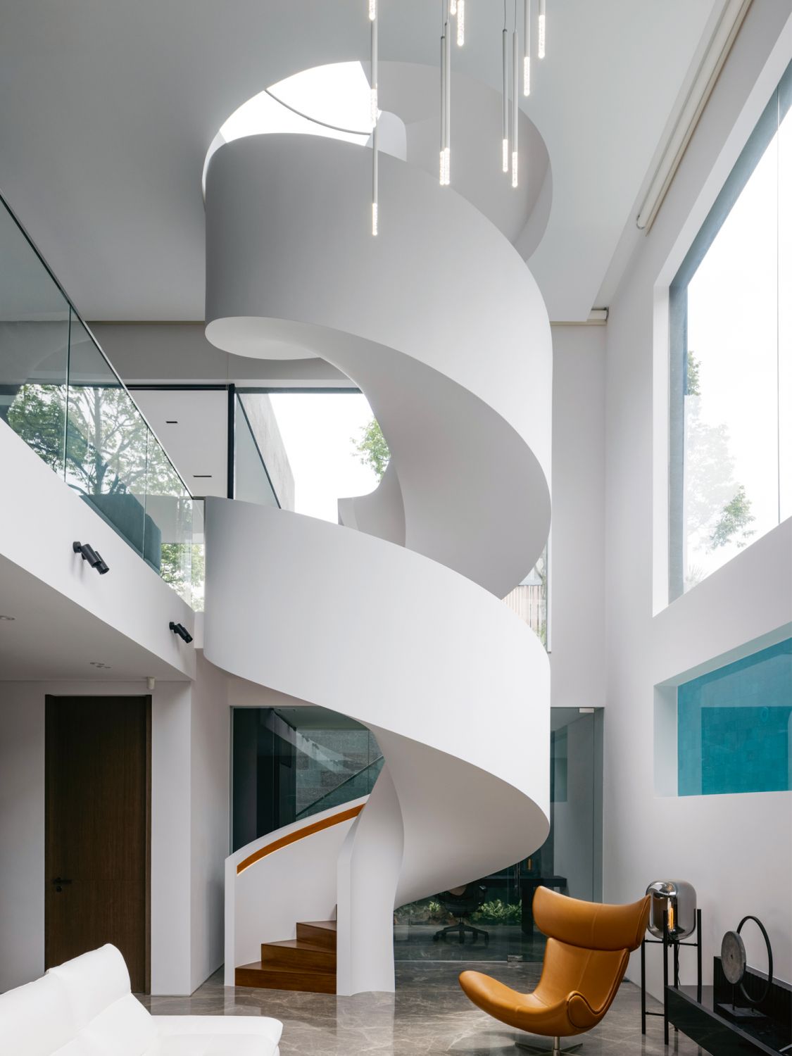 This striking spiral staircase is the centrepiece of the home