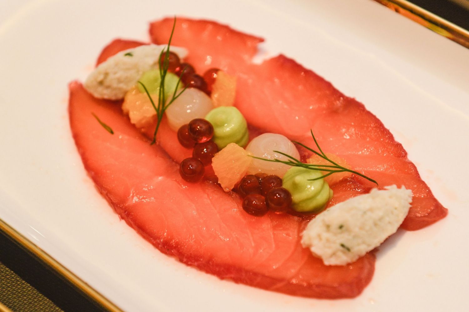 Citrus-cured salmon with crab meat, horseradish, lemon, avocado, orange, and The Macallan marinated salmon caviar, paired with The Macallan Classic Cut