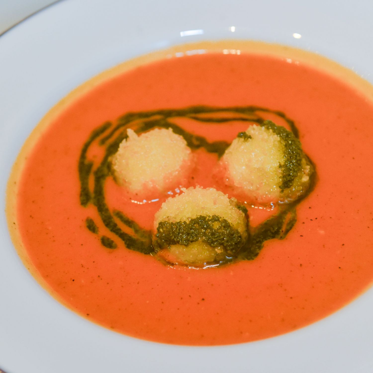 Vine-ripened tomato soup with Swiss cheese and croutons, paired with The Macallan Estate