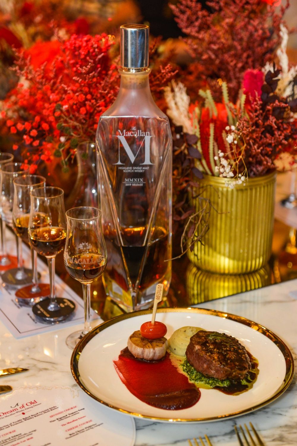 Grilled Australian Wagyu beef tenderloin, roasted garlic, creamed spinach, and peppercorn whisky sauce, paired with The Macallan M