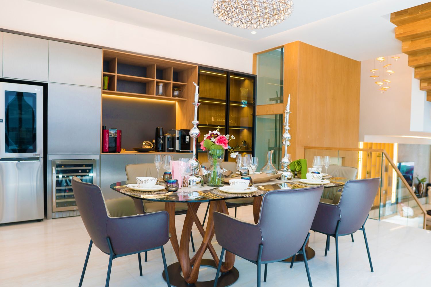The dining room features the lengthier version of the Porada Infinity table found in the living area