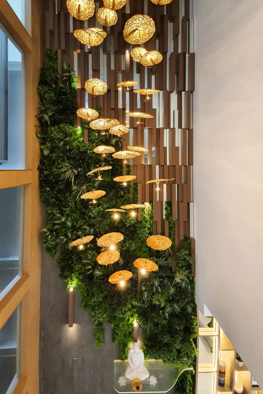 The 36-piece pendant Gold Moon chandelier from Catellani & Smith lights up the airwell