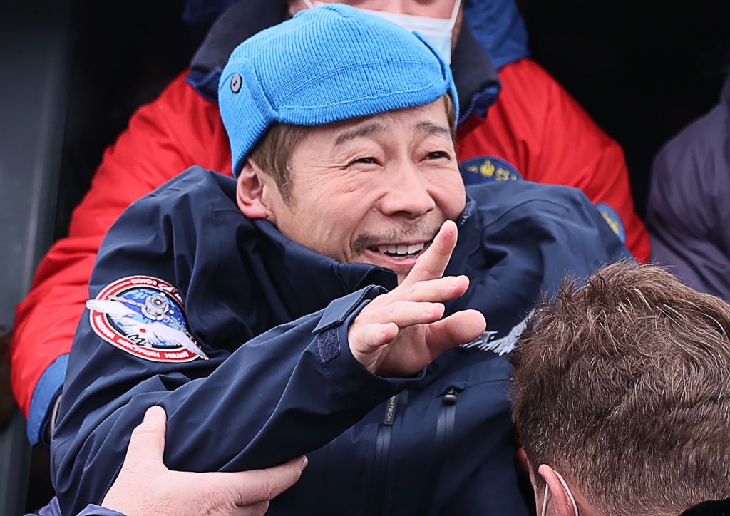 ZHEZKAZGAN, KAZAKHSTAN - DECEMBER 20, 2021: Space tourist Yusaku Maezawa arrives at a local airport on a helicopter after the landing of the Soyuz MS-20 spacecraft reentry capsule. The Soyuz MS-20 spacecraft reentry capsule carrying Roscosmos cosmonaut Alexander Misurkin and Japanese space tourists Yusaku Maezawa and Yozo Hirano landed in the steppes southeast of the town of Zhezkazgan at 6.13am Moscow Time. Sergei Savostyanov/TASS (Photo by Sergei Savostyanov\TASS via Getty Images)