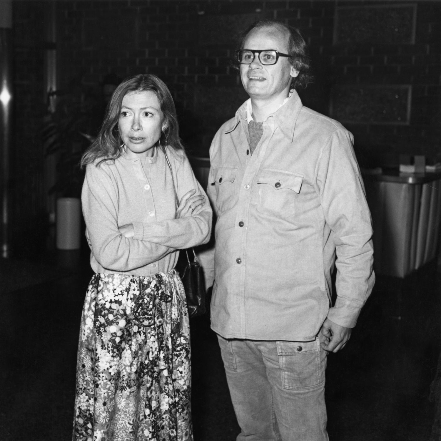American authors Joan Didion and her husband John Gregory Dunne (1932 - 2003) attend a party for the movie 'Play It As It Lays' at the Directors' Guild of America in Los Angeles, October 1972. The film was based on the 1970 novel of the same name by Didion, and she co-wrote the screenplay with Dunne. (Photo by Frank Edwards/Fotos International/Getty Images)