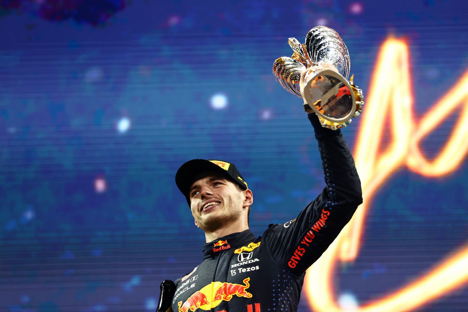 ABU DHABI, UNITED ARAB EMIRATES - DECEMBER 12: Race winner and 2021 F1 World Drivers Champion Max Verstappen of Netherlands and Red Bull Racing celebrates on the podium during the F1 Grand Prix of Abu Dhabi at Yas Marina Circuit on December 12, 2021 in Abu Dhabi, United Arab Emirates. (Photo by Mark Thompson/Getty Images) // Getty Images / Red Bull Content Pool // SI202112120280 // Usage for editorial use only //