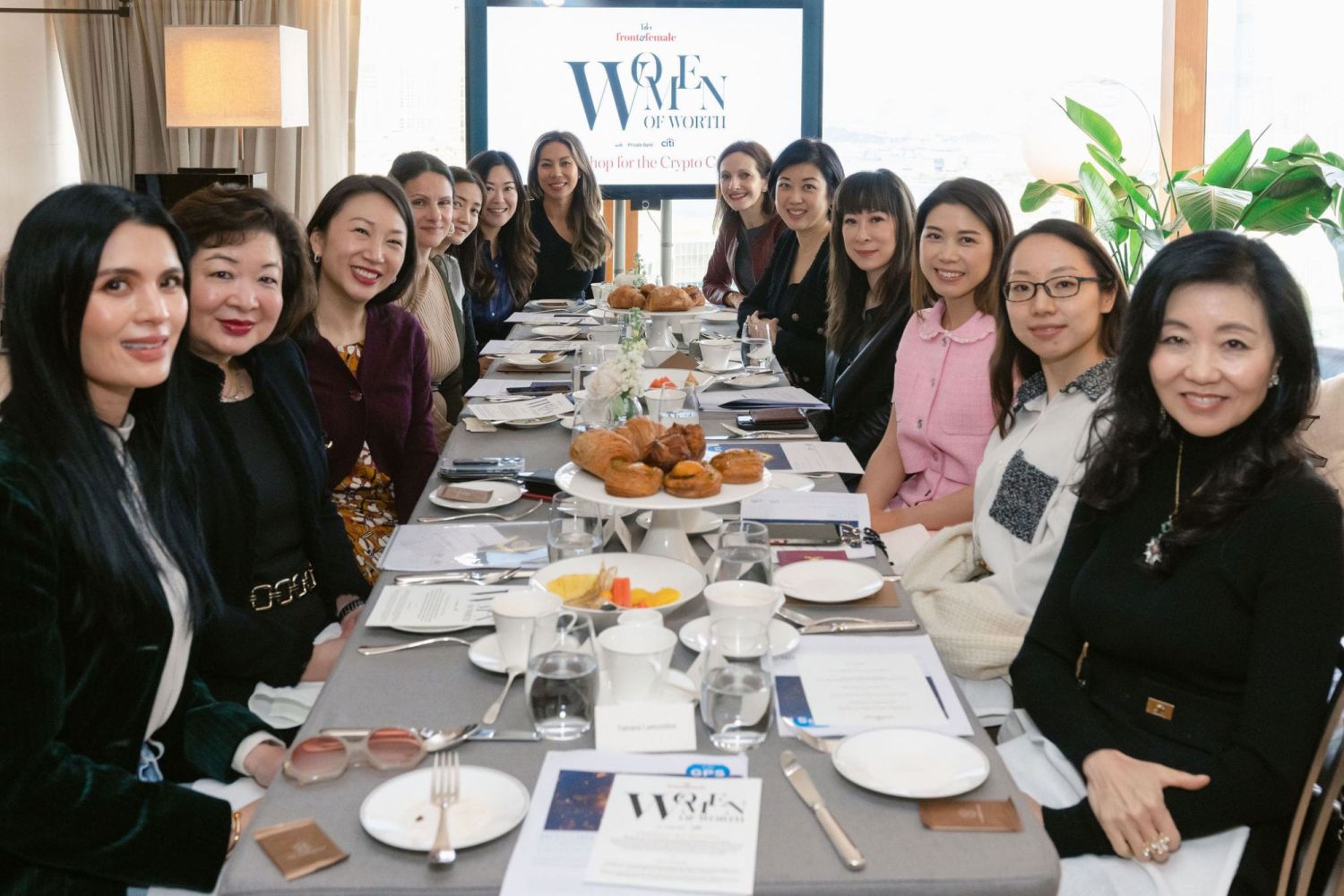 Accomplished Hong Kong women at a communal table for a Workshop for the Crypto Curious breakfast event