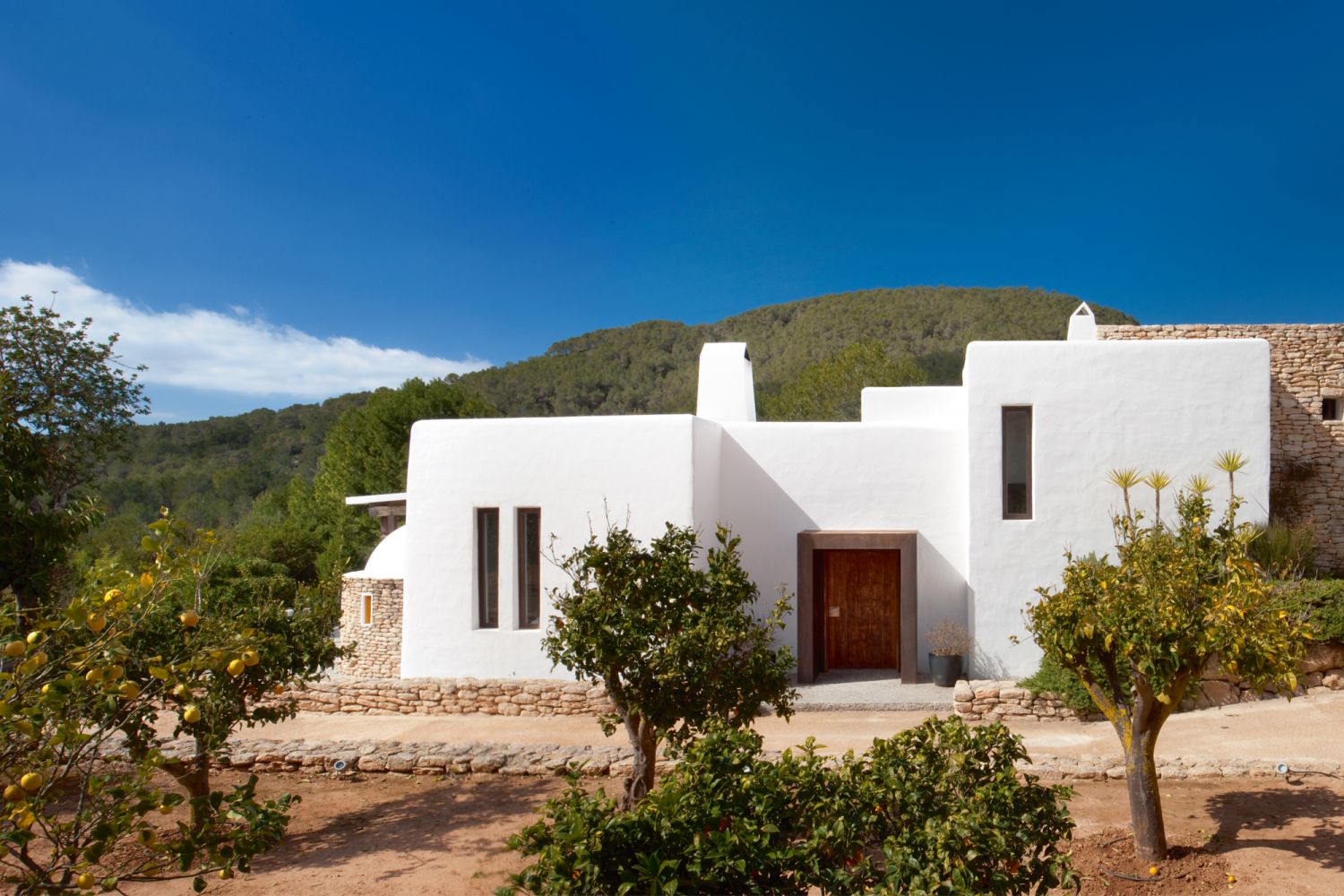 The home’s white facade is typical of traditional houses in Ibiza